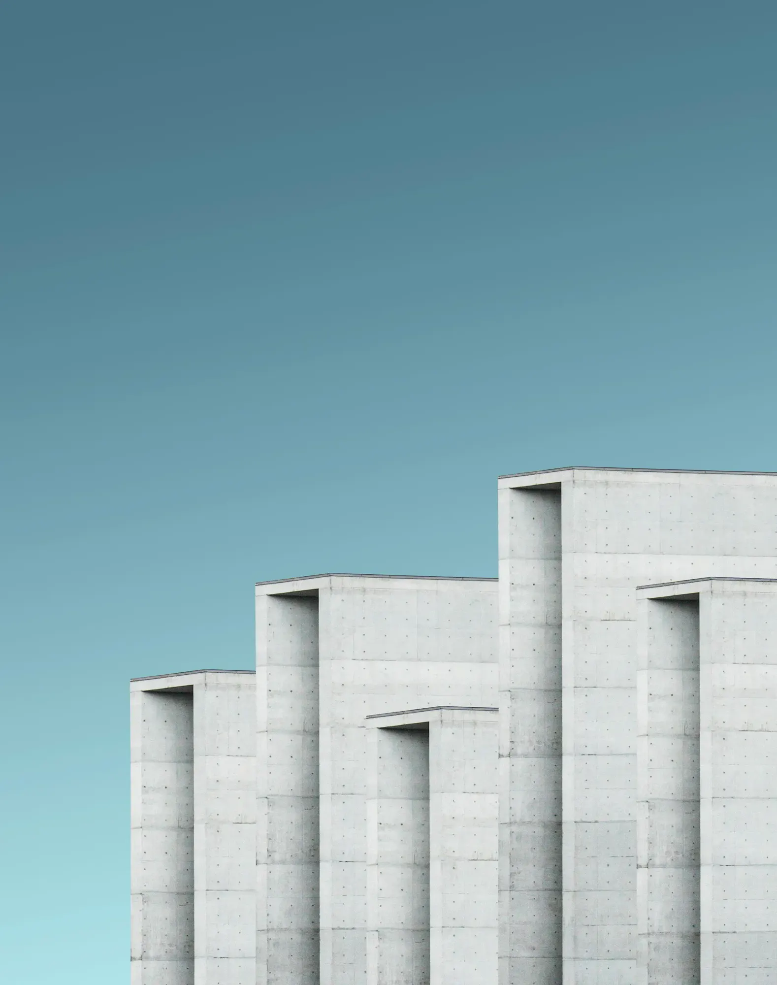 A grey concrete monolith against the sky